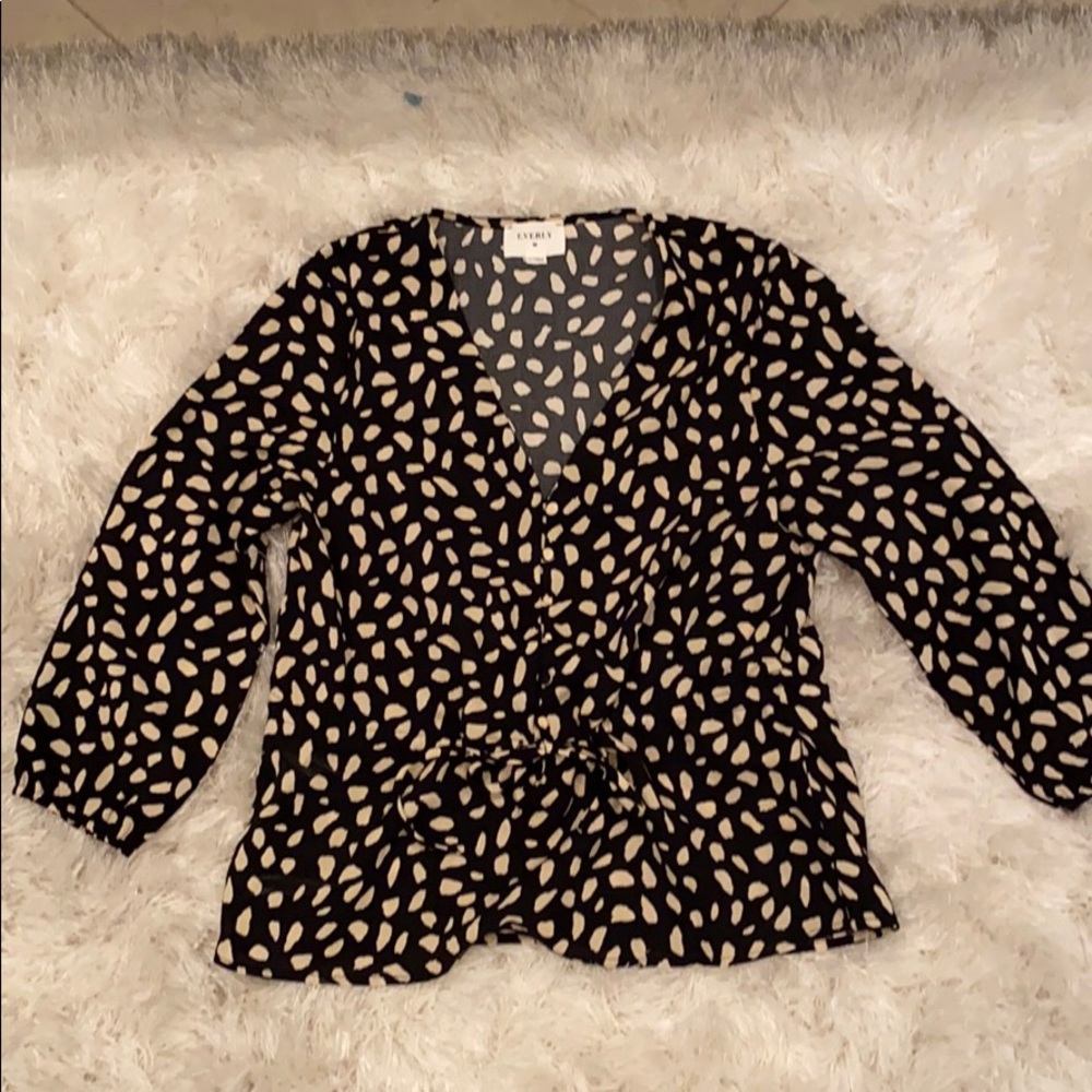 White and beige spotted top